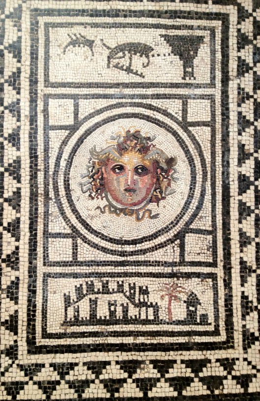 Medusa's head (Sec. IX BC) House of the Centaur. Pompeii.  On display at the Museo Archeologico Nazionale  