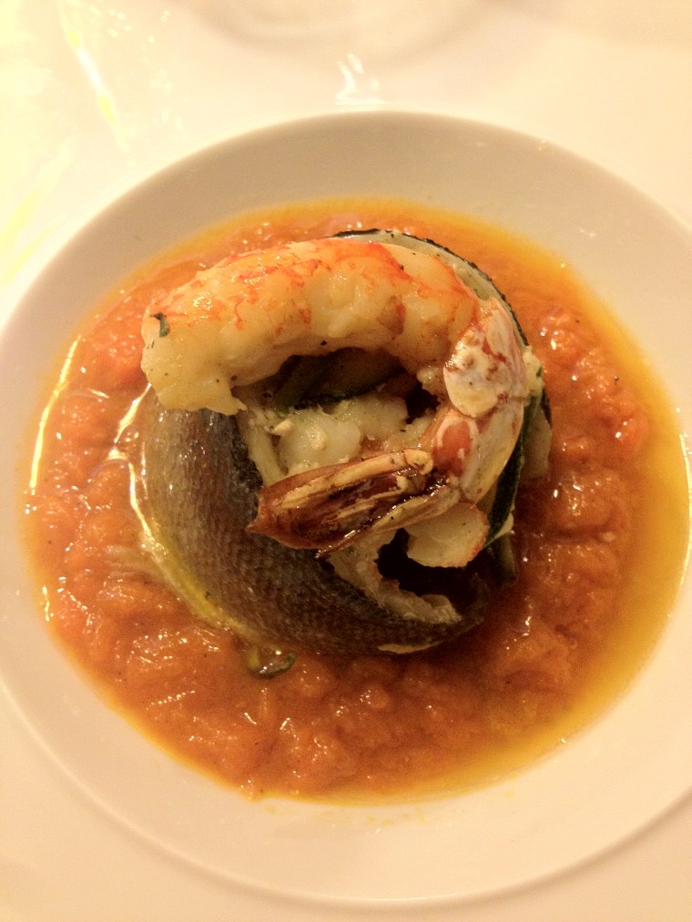 Sea Bass on a bed of spice pumpkin sauce topped with a grilled prawn at Signum Cubo Restaurant in Vico Equense. 
