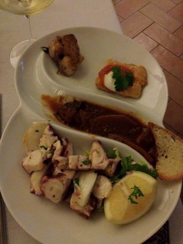 Sampling of seafood and fish at Vinaria including fresh octopus salad and fried grouper.