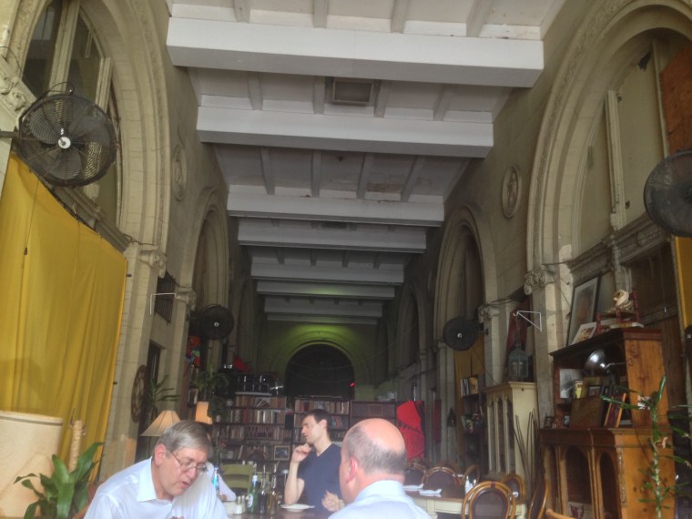 The casual dining at Soya & Pomodoro located on the building that is the last remaining intact arcade in Downtown Miami featuring large arches and pilasters with masonry medallions exhibiting symbols of Florida's history.
