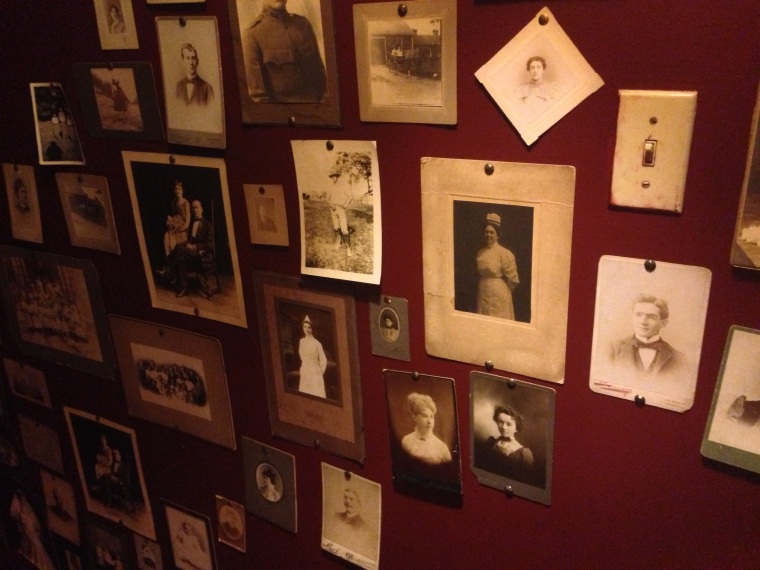 Vintage pictures and postcards on the wall going downstairs to the cellar at Le Chat Noir for live jazz.  You can order also appetizers and wine at the Bar while listening to the finest jazz music.